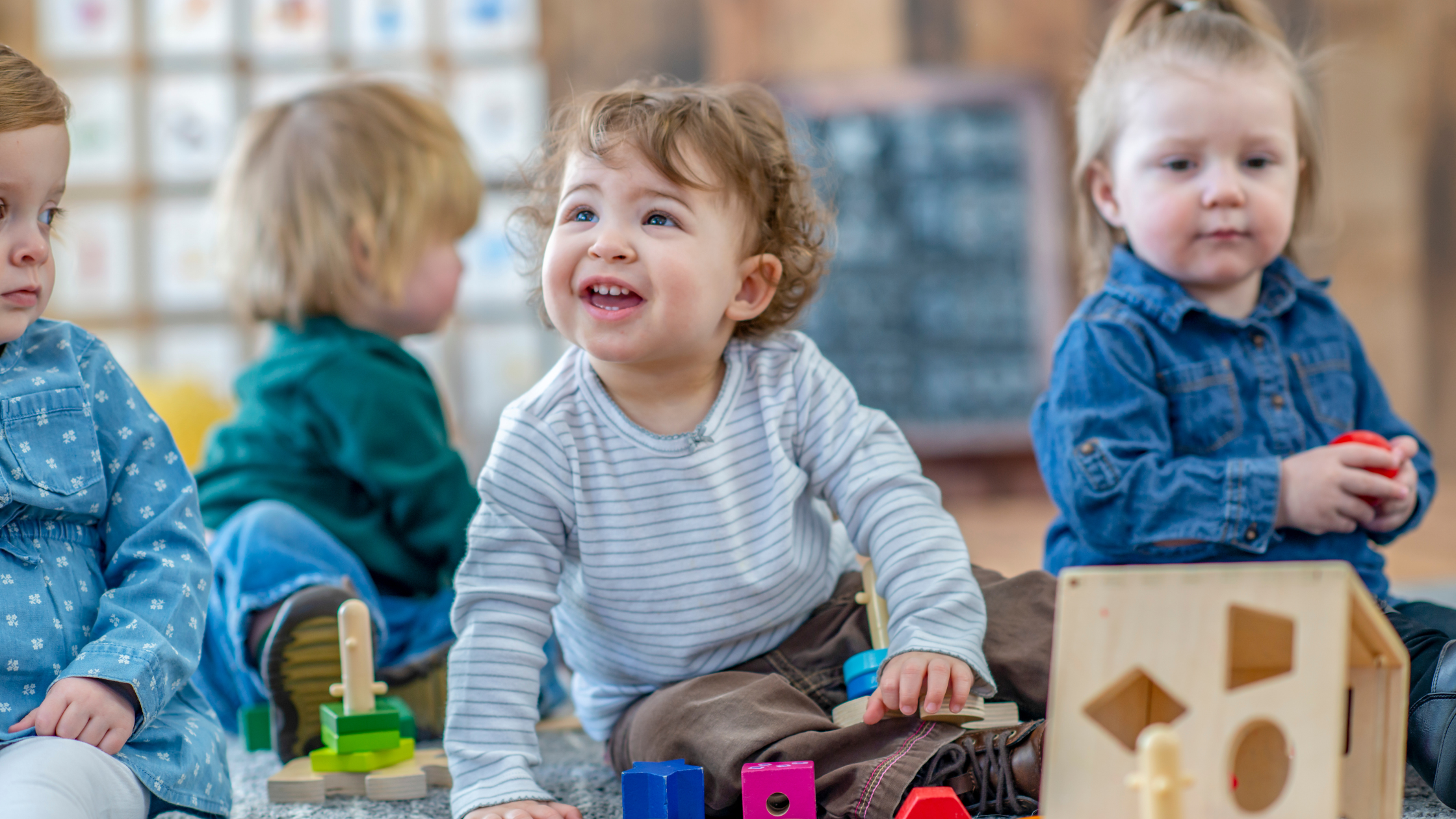 Four toddlers playing at nursery